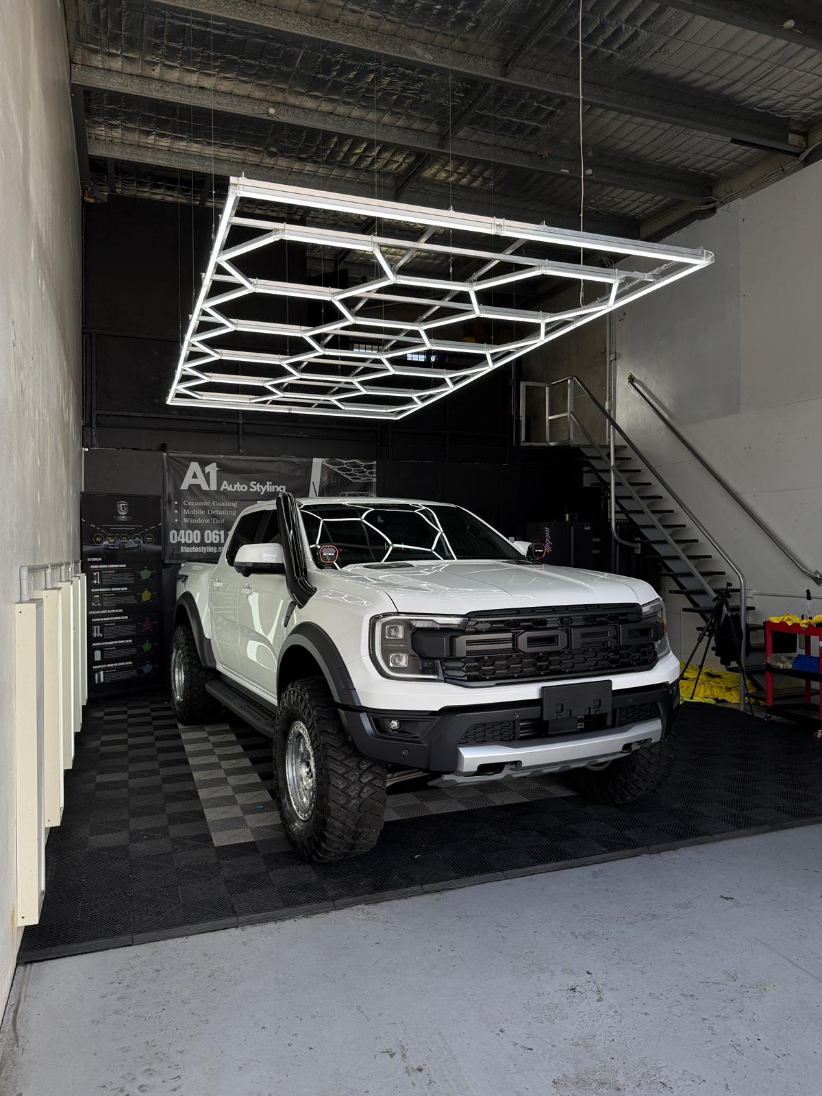 White Ford Ranger Raptor in the A1 Auto Styling workshop after ceramic coating and ceramic tint